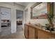 Inviting hallway with view into bedrooms and decorative console table at 4969 S Indian Trl, Evergreen, CO 80439