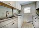 Bright laundry room featuring modern washer and dryer at 4969 S Indian Trl, Evergreen, CO 80439