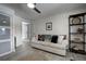 Cozy living room featuring a comfy sofa and shelving unit at 4969 S Indian Trl, Evergreen, CO 80439