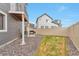 This backyard has a patio area with a grill, a lawn, and a wooden fence at 3963 N Quatar Ct, Aurora, CO 80019