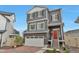 Charming two-story home featuring a red door and a well-maintained front yard at 3963 N Quatar Ct, Aurora, CO 80019