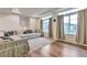 Bright living room featuring large windows, recessed lighting, and a comfortable sectional couch at 3963 N Quatar Ct, Aurora, CO 80019