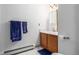 Bathroom with wood vanity, white countertop, and practical towel rack at 4855 Edison Ave # 112, Boulder, CO 80301