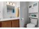 White bathroom featuring a sink, toilet, and storage cabinet for toiletries at 4855 Edison Ave # 112, Boulder, CO 80301