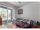 Compact bedroom with a sliding glass door to the exterior at 4855 Edison Ave # 112, Boulder, CO 80301