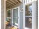 Charming condo entrance with a screen door, unit number, and a small porch for outdoor storage at 4855 Edison Ave # 112, Boulder, CO 80301