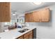 Efficient kitchen layout with a breakfast bar, a modern sink, and adjacent dining area for convenient meals at 4855 Edison Ave # 112, Boulder, CO 80301