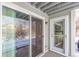 Covered patio with glass sliding doors and a small railing at 4855 Edison Ave # 112, Boulder, CO 80301