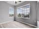 Bright bedroom with wood-look floors and large windows providing ample natural light and neighborhood views at 8475 Pebble Creek Way # 204, Highlands Ranch, CO 80126