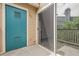 View of the patio with screen door to interior and blue door to exterior at 8475 Pebble Creek Way # 204, Highlands Ranch, CO 80126