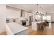 Modern kitchen boasts stainless appliances, sleek countertops, and an open layout flowing into the living area at 4335 N Pecos St, Denver, CO 80211