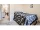 Inviting bedroom featuring a floral bedspread and closet for clothing storage at 2111 W 80Th Ave, Denver, CO 80221