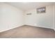 Spacious basement area features neutral walls, carpet flooring, and a window for light at 2111 W 80Th Ave, Denver, CO 80221