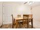 Cozy dining area featuring a wooden table and chairs, with natural light at 2111 W 80Th Ave, Denver, CO 80221