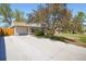Charming single-story home with a well-maintained front yard and driveway at 2111 W 80Th Ave, Denver, CO 80221