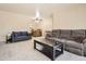 Spacious living room with comfortable seating, open to the dining area at 2111 W 80Th Ave, Denver, CO 80221