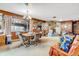 Dining area with wood-paneled walls and a stone fireplace at 1941 W 160Th Ave, Broomfield, CO 80023