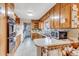 Retro kitchen with wood cabinets and ample counter space at 1941 W 160Th Ave, Broomfield, CO 80023