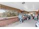 Enclosed sunroom with brick walls and ample storage at 1941 W 160Th Ave, Broomfield, CO 80023