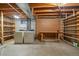Utility basement with washer, dryer, workbench, and ample storage shelving at 14735 W Ellsworth Ave, Golden, CO 80401