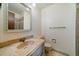 Cozy bathroom featuring a marbled sink, framed mirror and shower with glass door at 14735 W Ellsworth Ave, Golden, CO 80401