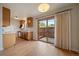 Dining area with sliding glass doors to a private patio adjacent to the kitchen at 14735 W Ellsworth Ave, Golden, CO 80401