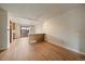 Bright, open living room featuring hardwood floors, natural light, and a pass-through to the kitchen at 14735 W Ellsworth Ave, Golden, CO 80401