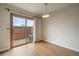 Room with sliding glass door access to private outdoor patio with privacy fence at 14735 W Ellsworth Ave, Golden, CO 80401