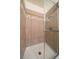 Bathroom shower encased in patterned tile and sealed with glass door at 14735 W Ellsworth Ave, Golden, CO 80401