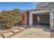 Carport attached to a charming brick home with concrete driveway at 6032 Estes St, Arvada, CO 80004