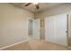 Bedroom featuring neutral walls, plush carpet, and a spacious closet for ample storage at 19820 W 57Th Ln, Golden, CO 80403