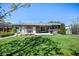 Lush backyard featuring a well-maintained lawn and mature trees at 12154 W Exposition Dr, Lakewood, CO 80228