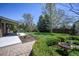 Spacious backyard featuring a well-manicured lawn and mature trees at 12154 W Exposition Dr, Lakewood, CO 80228