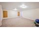 Basement featuring neutral carpet and flexible living space at 12154 W Exposition Dr, Lakewood, CO 80228