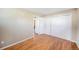 Bedroom featuring hardwood floors, a closet, and neutral wall color at 12154 W Exposition Dr, Lakewood, CO 80228