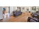 Spacious living room with hardwood floors, classic furnishings, and an open layout perfect for entertaining at 12154 W Exposition Dr, Lakewood, CO 80228