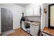 Mud room features a built-in desk and cabinets with a door leading to the outside at 12154 W Exposition Dr, Lakewood, CO 80228
