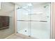 Modern glass-enclosed shower with a built-in niche for toiletries at 12154 W Exposition Dr, Lakewood, CO 80228