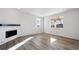 Stylish living room featuring wood floors and a modern fireplace at 1080 Joseph Pl, Erie, CO 80026