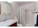 Clean bathroom with shower/tub combo and vanity at 3225 S Garrison St # 41, Lakewood, CO 80227