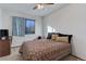 Cozy bedroom with double bed, window, and ceiling fan at 3225 S Garrison St # 41, Lakewood, CO 80227