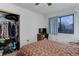 Bedroom with double bed, closet, and built-in shelving at 3225 S Garrison St # 41, Lakewood, CO 80227