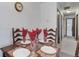 Dining area with table set for four, view of hallway at 3225 S Garrison St # 41, Lakewood, CO 80227