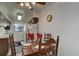 Bright dining area with wood table and chairs, ready for Gathering meals at 3225 S Garrison St # 41, Lakewood, CO 80227