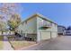 Light green exterior of the house with a two-car garage and balcony at 3225 S Garrison St # 41, Lakewood, CO 80227