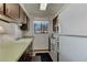 Efficient kitchen with white appliances and wood cabinets at 3225 S Garrison St # 41, Lakewood, CO 80227