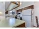 Small kitchen with wood cabinets and appliances at 3225 S Garrison St # 41, Lakewood, CO 80227