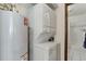 Stackable washer and dryer in laundry room, with adjacent bath at 3225 S Garrison St # 41, Lakewood, CO 80227