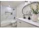Bathroom features white marble and a tub with shower at 6876 Quay Ct, Arvada, CO 80003