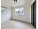 Bright bedroom with two windows and light wood flooring at 6876 Quay Ct, Arvada, CO 80003